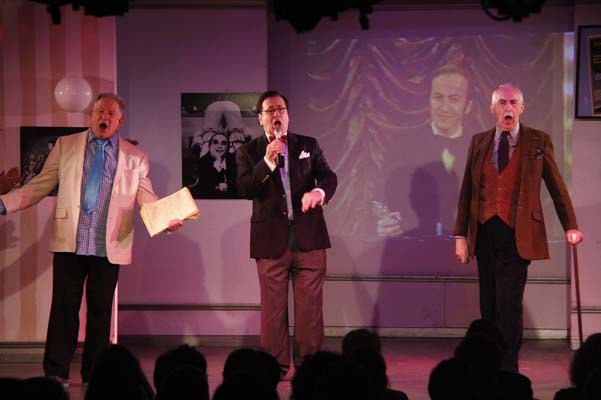 Harvey Evans, Lee Roy Reams and Lawrence Merritt, with Ron Field in the backgroundaccepting one of his two TONYS for APPLAUSE
